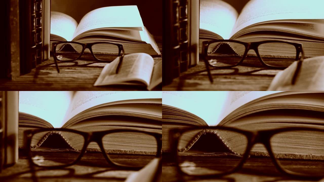 用眼镜和书籍打开圣经。