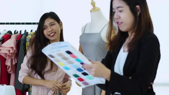两名亚洲年轻设计师兴高采烈地开始新事业