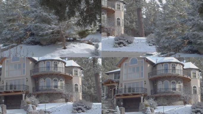 冬天被雪覆盖的房子。穿过白雪皑皑的树林。