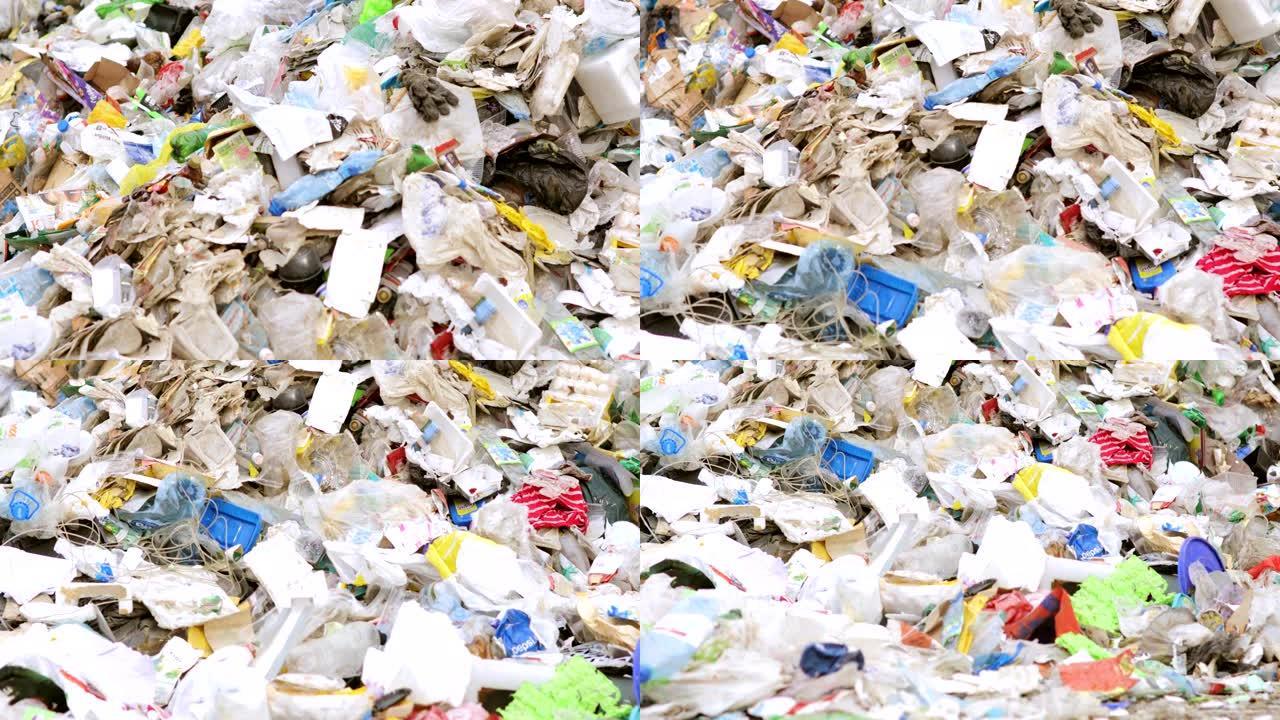 成堆的不同塑料和纸质垃圾进行分类和回收