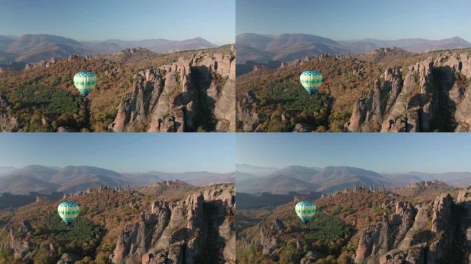 风景如画的岩石上的热气球