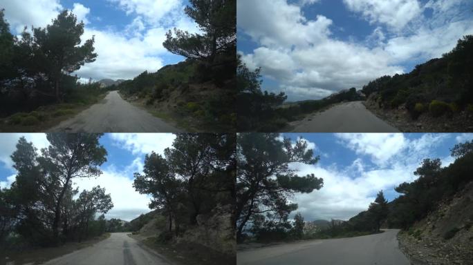 视点射击。汽车沿着海边陡峭的狭窄道路爬到山上，从汽车上可以看到。