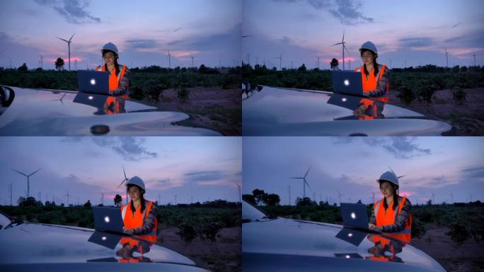 场景慢动作工程师亚洲妇女在晚上使用笔记本电脑评估风力涡轮机，可再生能源工厂的概念