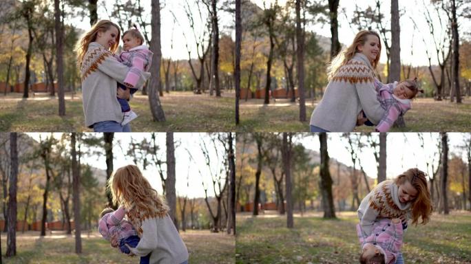 秋天公园里有女儿的母亲