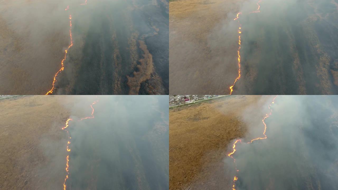 从燃烧的第聂伯罗盆地沼泽升起的灰色烟卷的空中射击