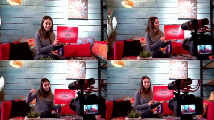 Pretty influencer正在用纸板显示 “订阅-跟随-分享” 字样