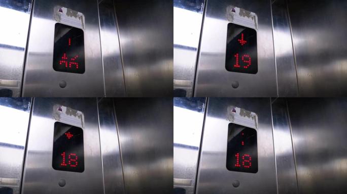 带有箭头向下的电梯中的数字显示显示从24到17的楼层