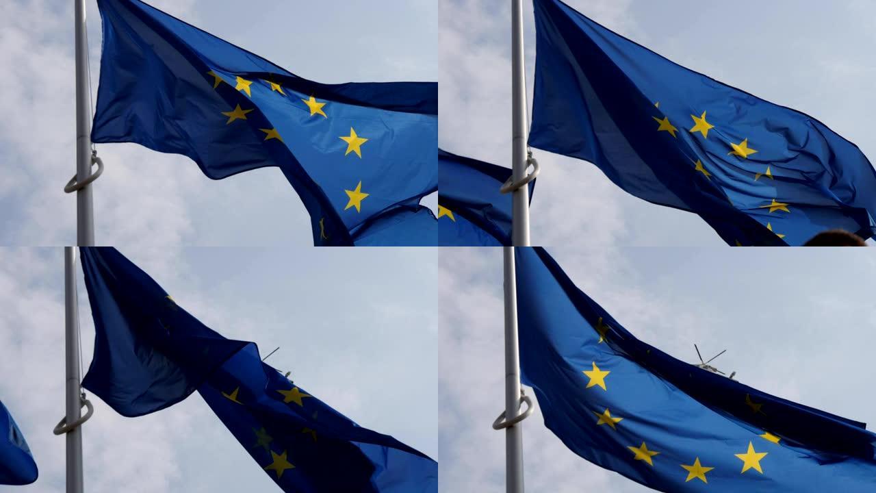慢镜头背景是一面印有警用直升机标志的欧盟旗帜