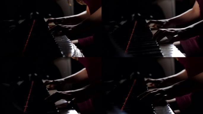 在生锈的钢琴琴键上关闭女钢琴家的手指，arms独奏音乐。女音乐家演奏的手。