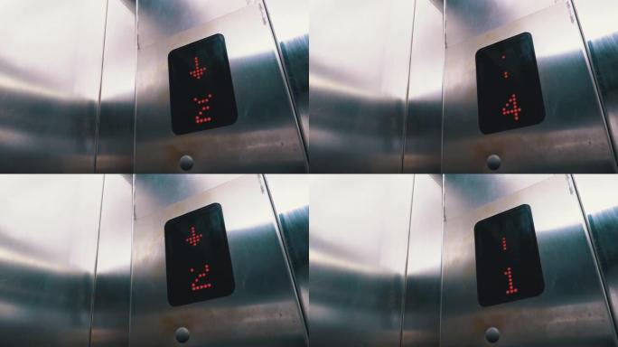 带箭头向下的电梯中的数字显示器显示从第7层到第1层的楼层