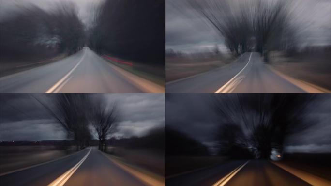天黑时在高速公路上开车。时间流逝。黄昏日落路灯。晚上，摄像头在前面，挡风玻璃参考。日落之后，晚上在高