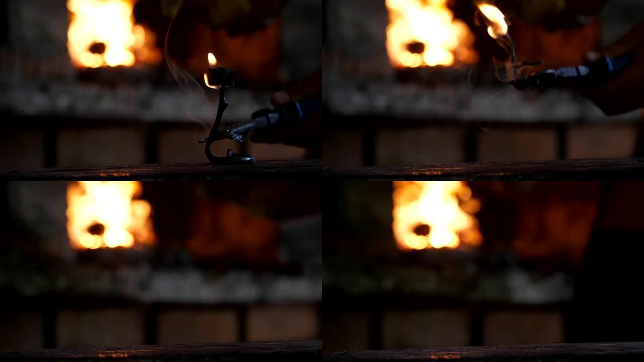 在铁匠车间的背景中，将熔融的玫瑰铁放在带有闪闪发光的炉子的大铁砧上的奇妙景色。