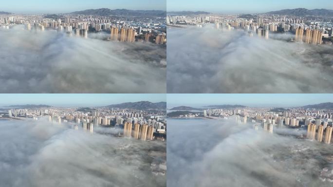 航拍平流雾中的威海海信海景壹号高楼