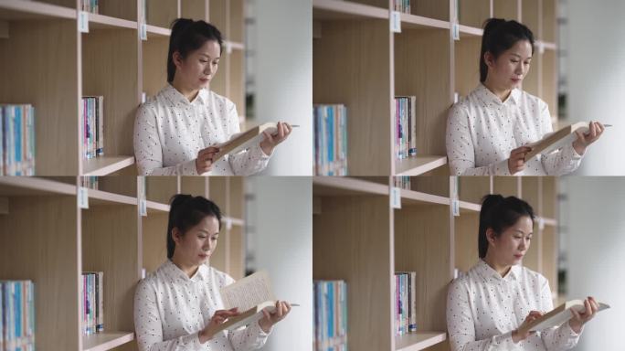 中年女性在图书馆学习阅读