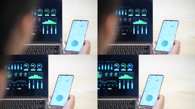 女性使用手机和笔记本电脑分析财务报告
