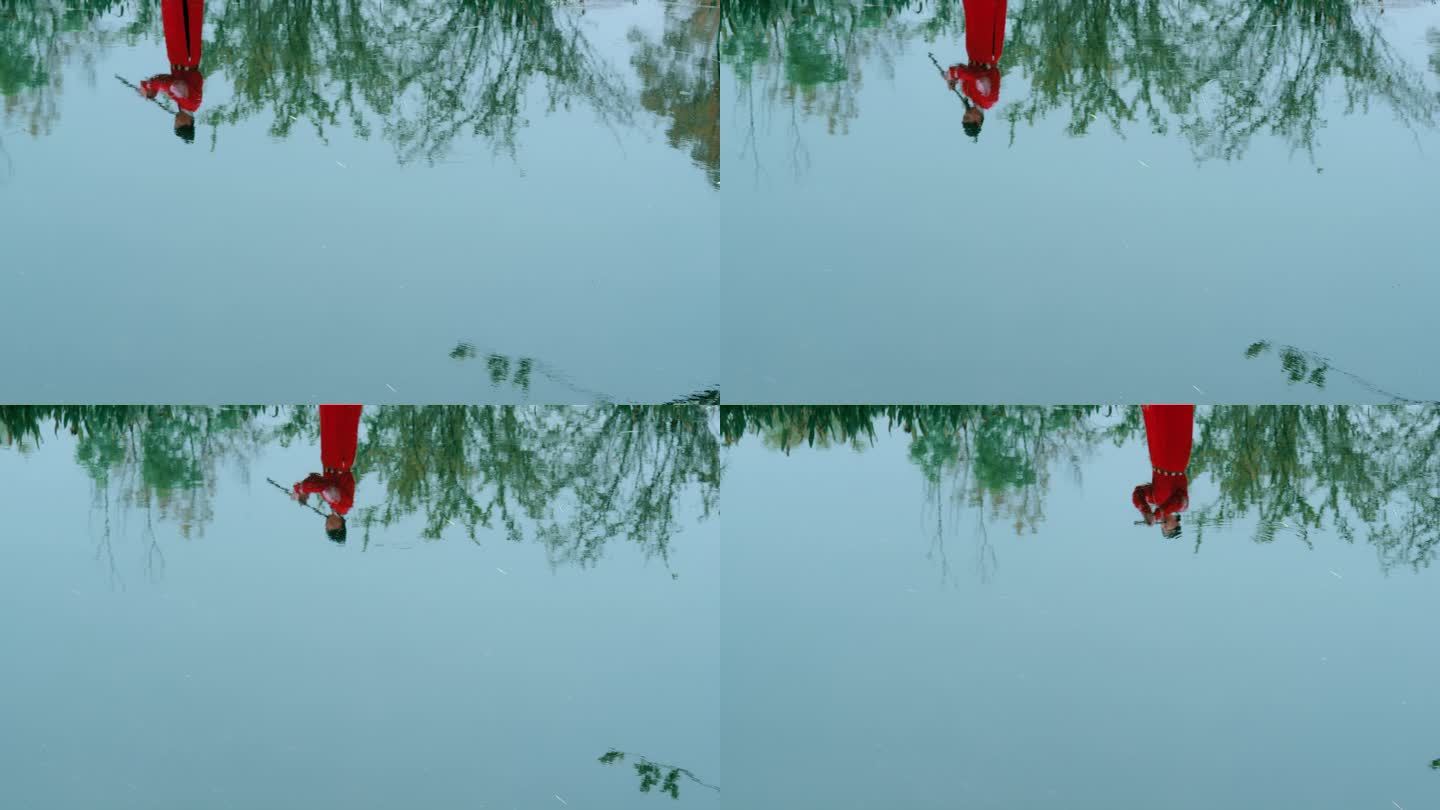 【4K】红色古装男子水边吹箫倒影