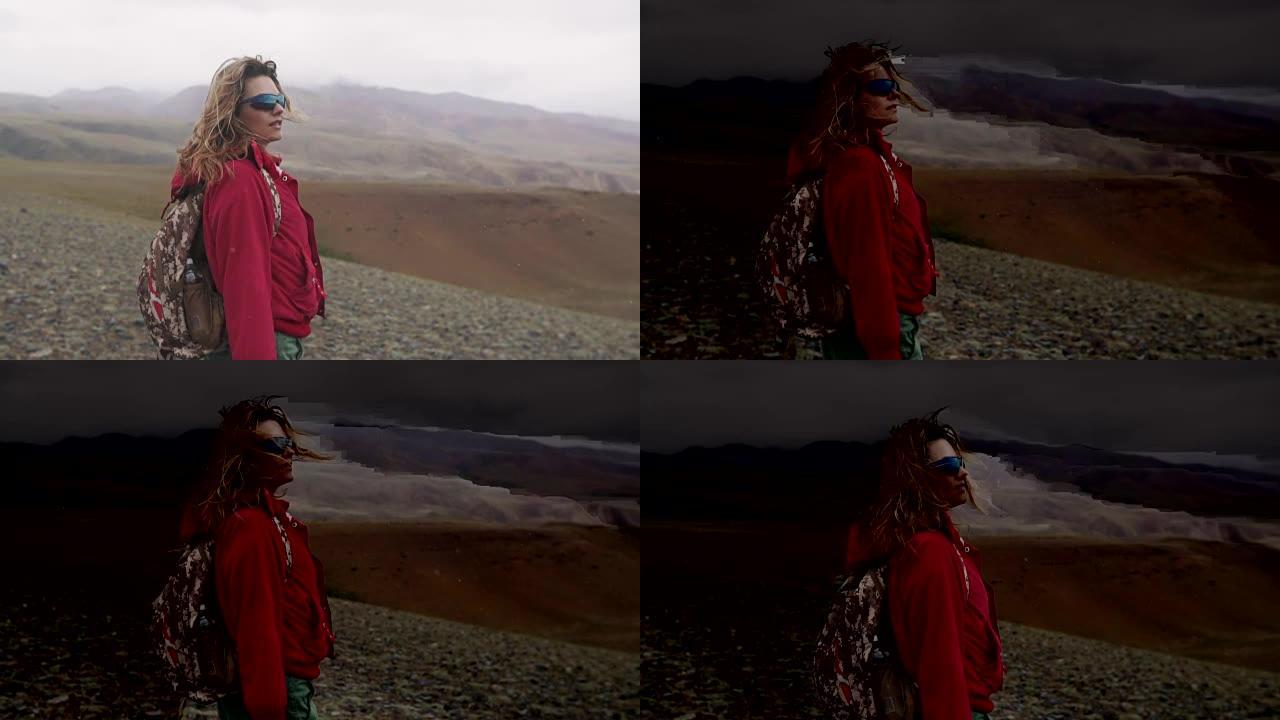 徒步旅行。山里的女孩旅行者。雾和雨。带背包的游客肖像