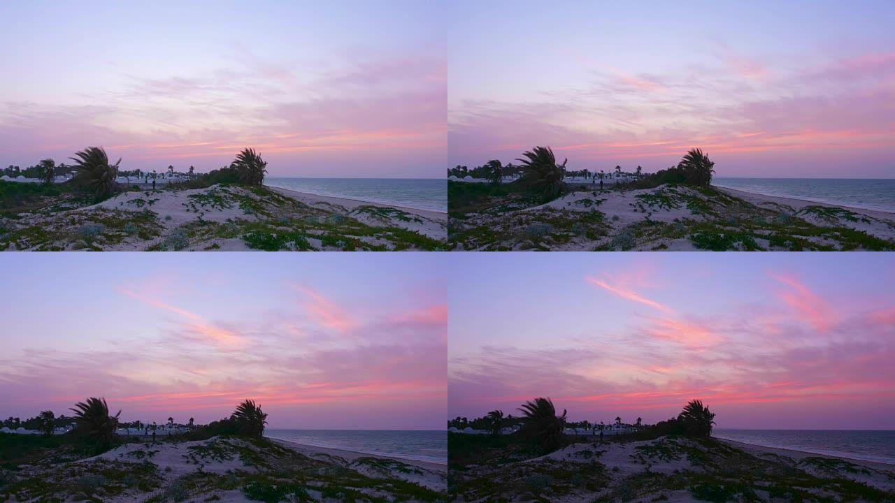 从海滩上可以看到阿拉伯城市和海洋的日落美景，延时