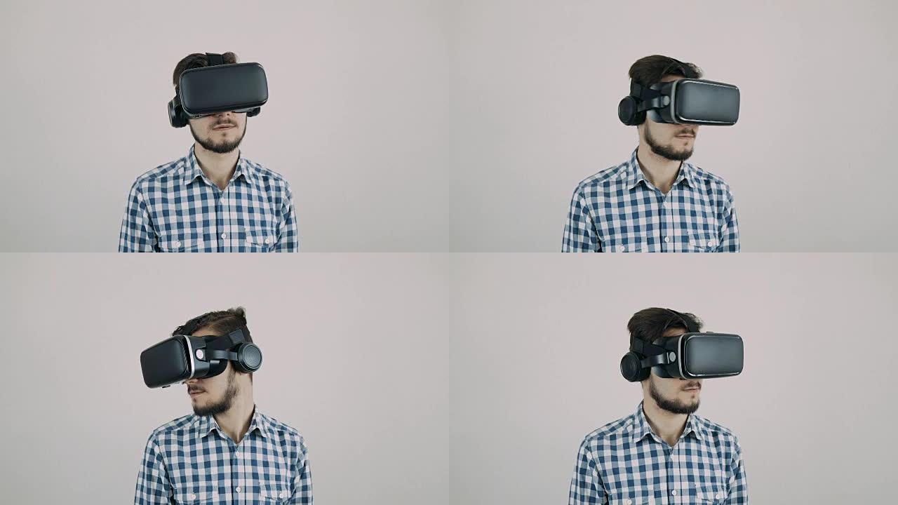 戴着虚拟现实谷歌/虚拟现实眼镜的年轻人