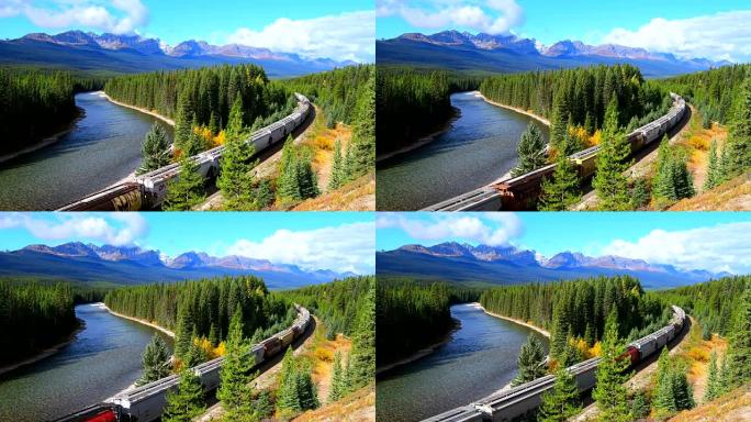 火车沿着班夫加拿大落基山脉的弓河行驶