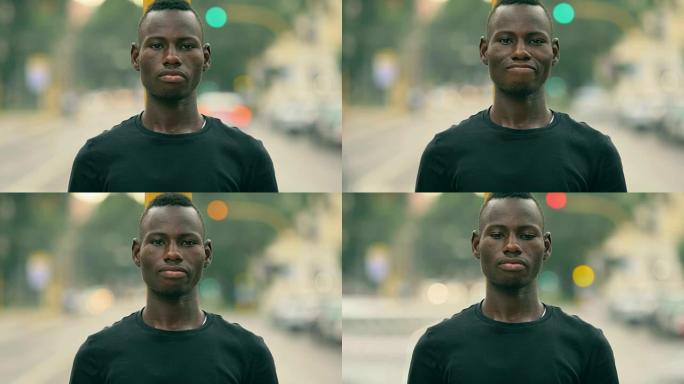 骄傲的非洲年轻人的肖像凝视着相机-户外