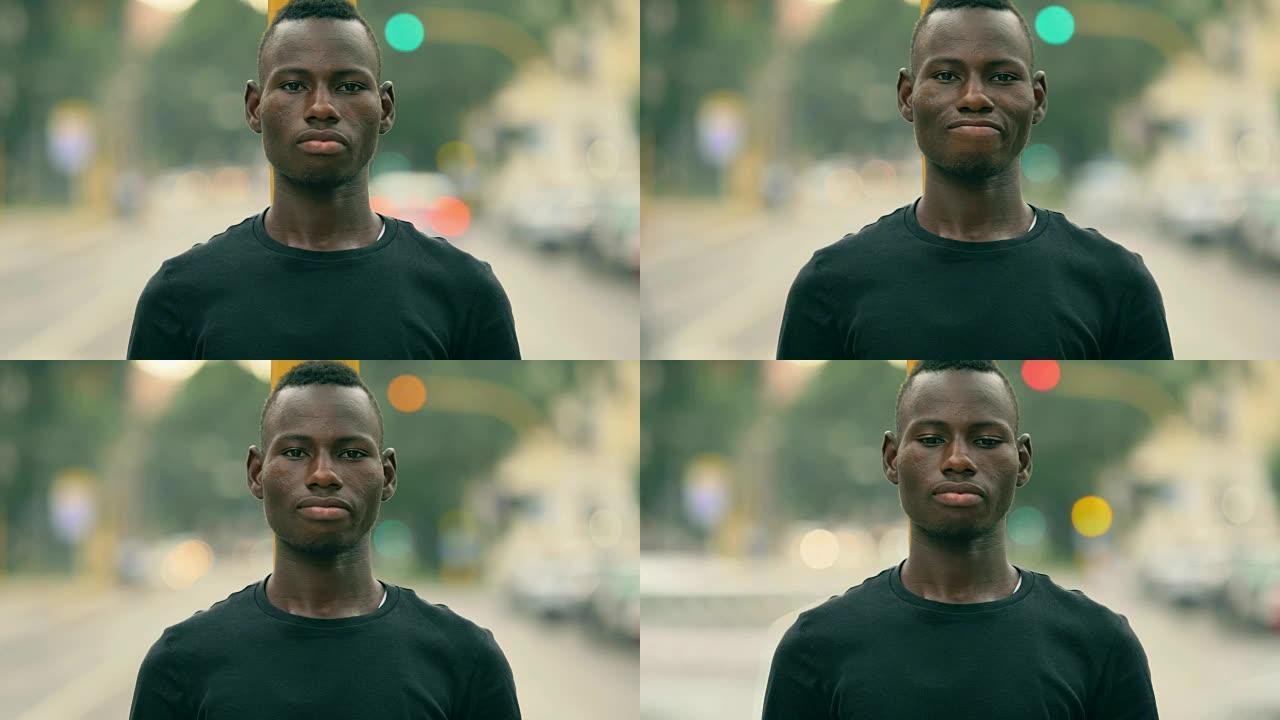 骄傲的非洲年轻人的肖像凝视着相机-户外