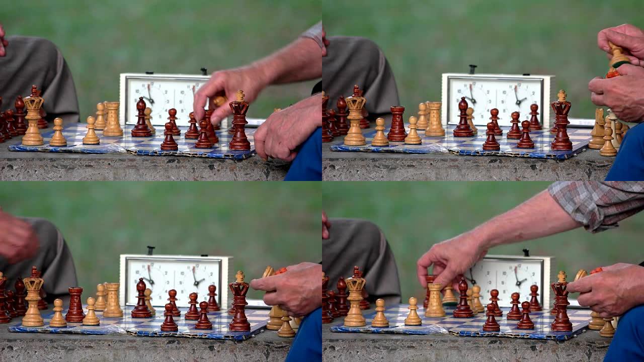活跃的退休人士，两个老朋友在公园下棋。