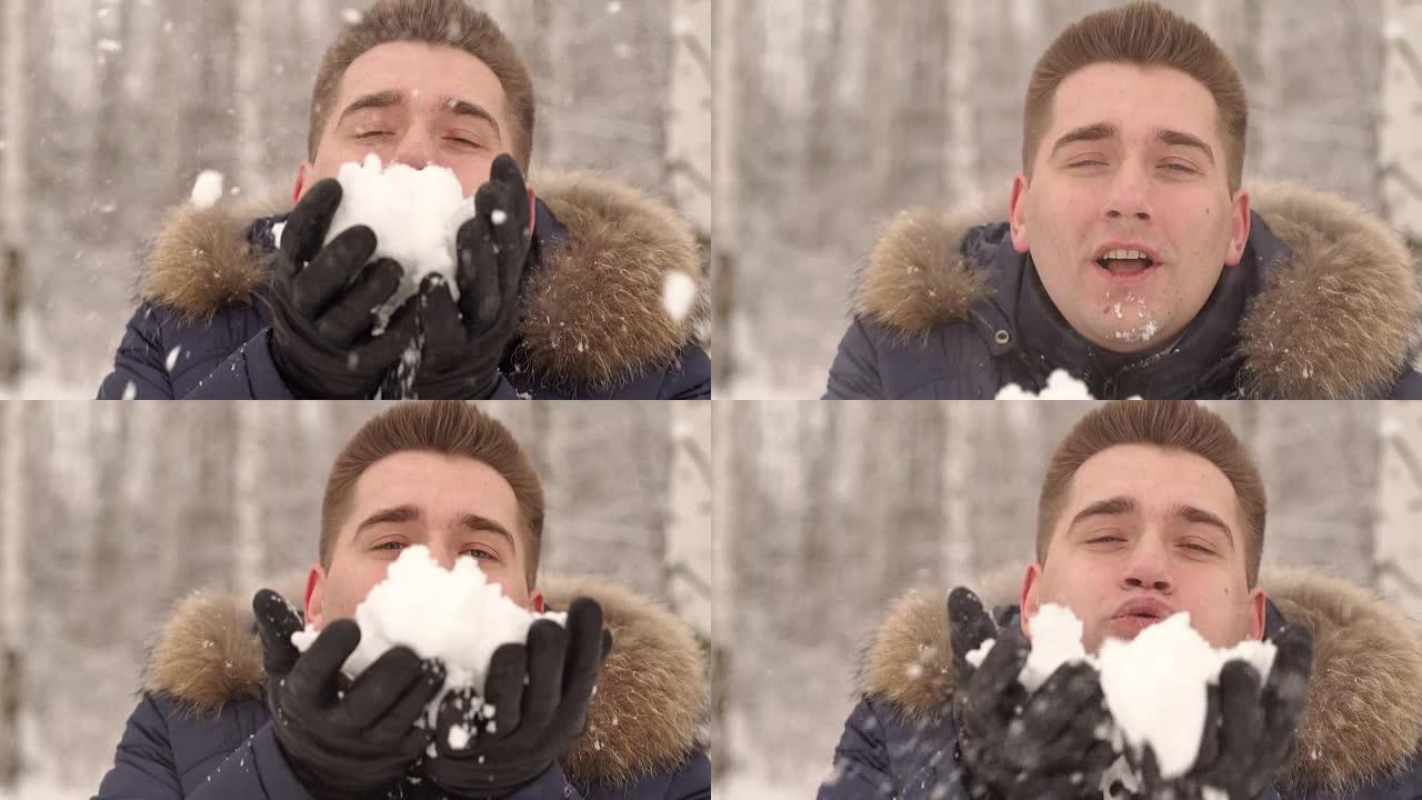 一个年轻人在雪地上吹的特写镜头。