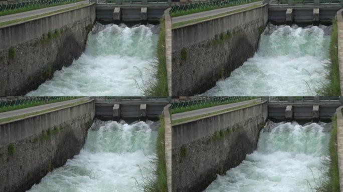 河流大坝-在寒冷的河流中流动和飞溅的水。