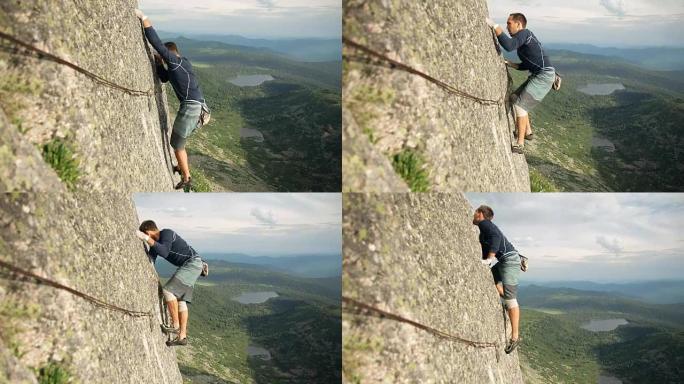 一个勇敢的年轻人独自爬上高高的岩石，没有保险。