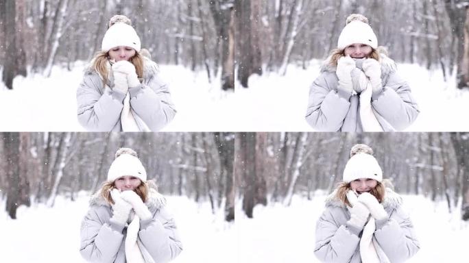 冬天降雪时一个可爱的女孩的肖像。