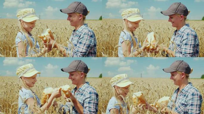 一个女农夫和一个女孩在麦田上打碎了一条面包。慷慨的复古概念
