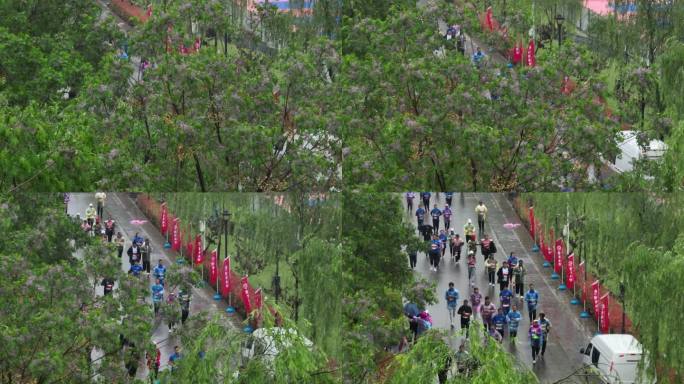 雨天迷你马拉松欢呼招手航拍城市欢乐跑