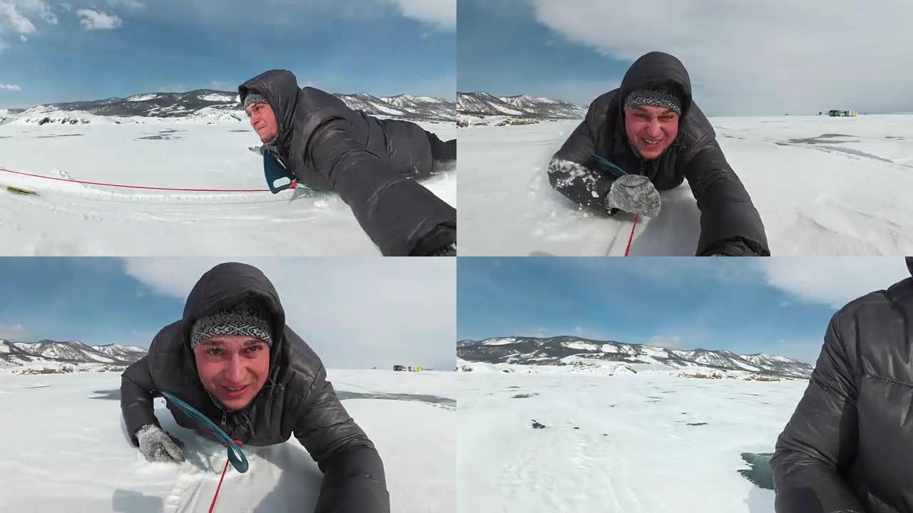 极端的人正在冰船上滚下雪冰。冰船用绳子绑在汽车上。雪飞向脸上。俄罗斯疯狂的乐趣。