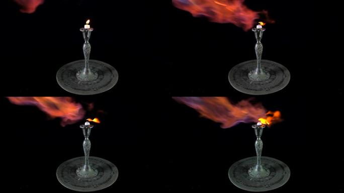 仿古银架燃烧蜡烛上的慢动作喷灯火焰喷射器