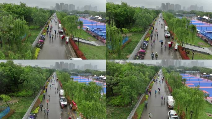 雨天迷你马拉松欢呼招手航拍城市欢乐跑