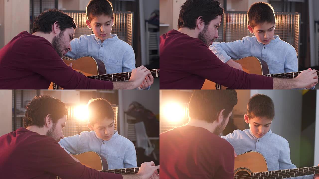 男子教小男孩如何弹吉他