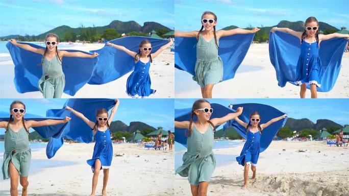 小女孩在热带度假期间用沙滩巾玩得开心
