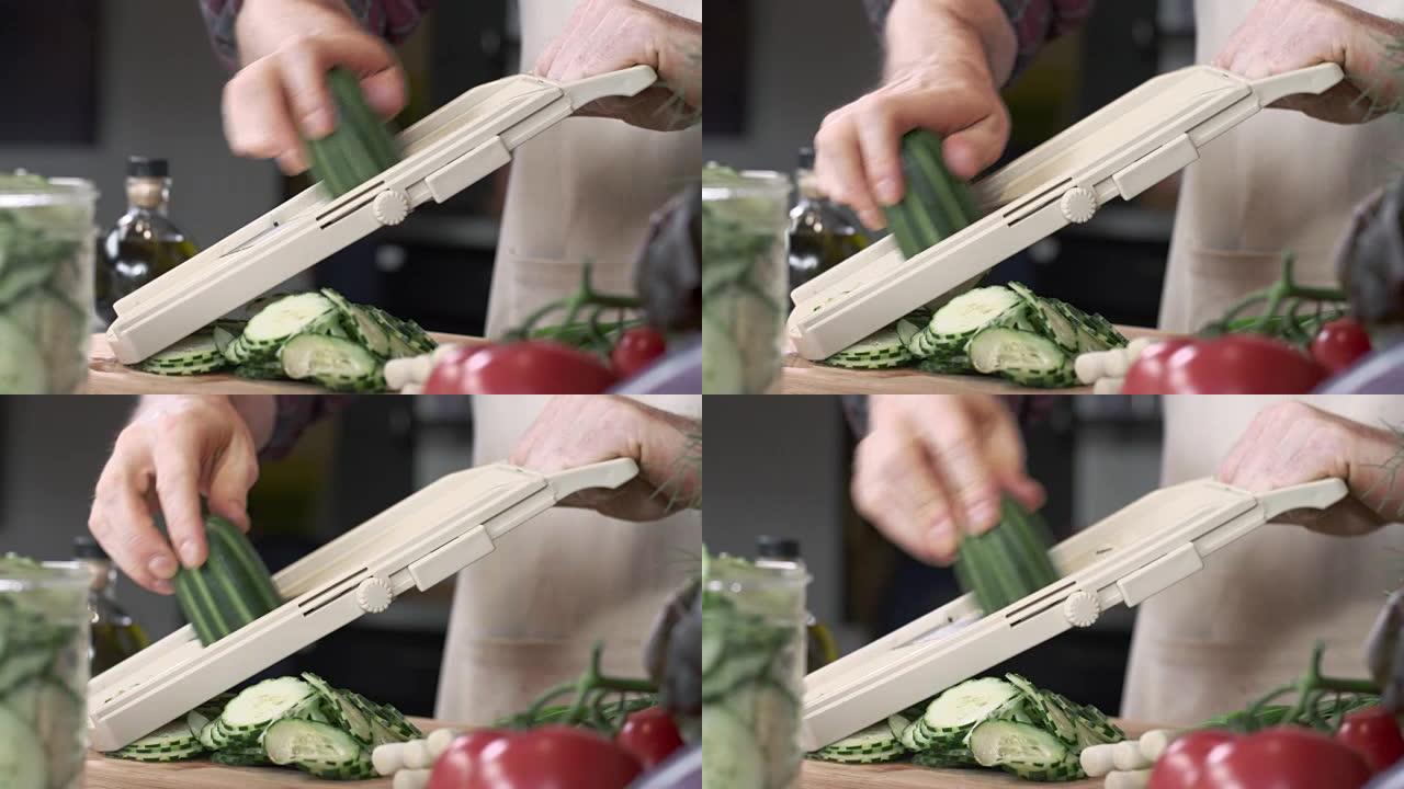 厨师用曼陀林切片新鲜黄瓜的跟踪镜头