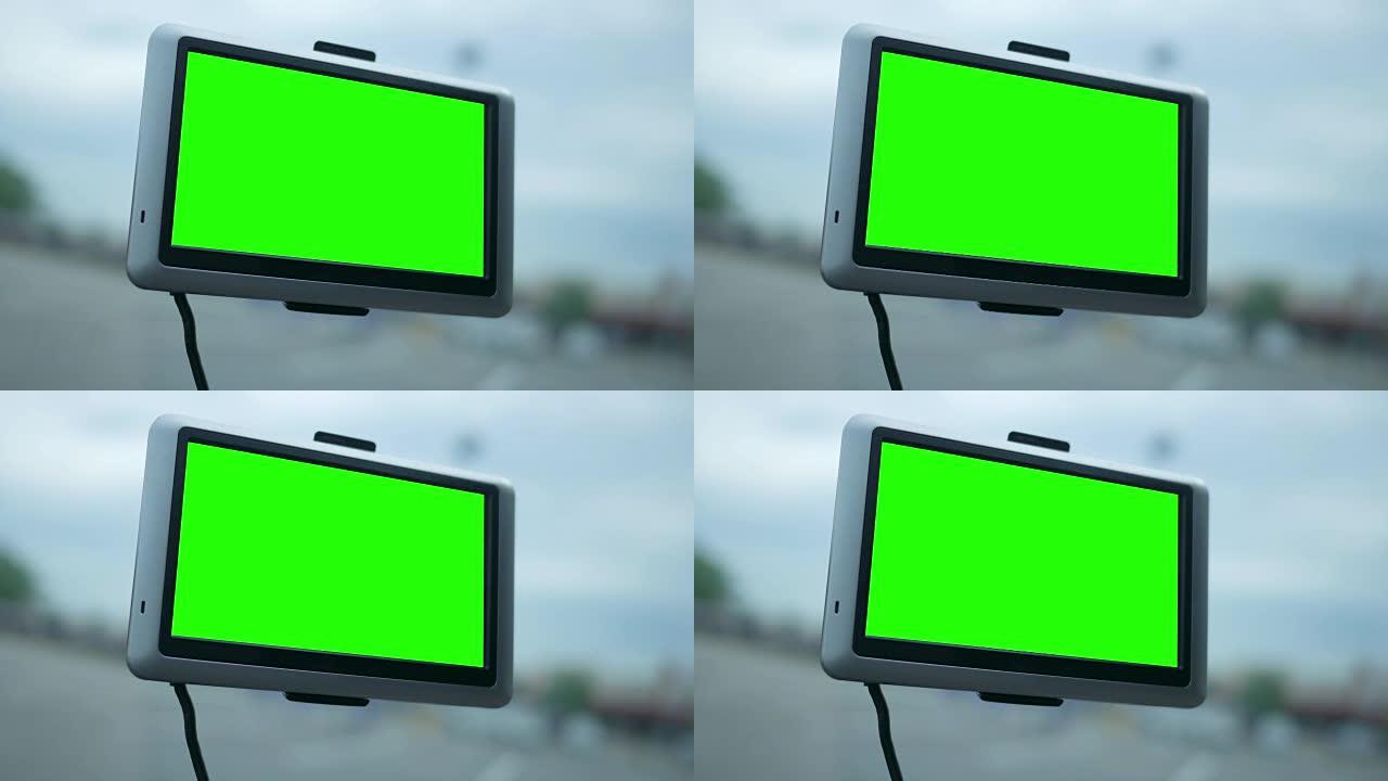 汽车仪表板中的现代全球定位系统屏幕，带有绿色屏幕，用于拍摄角图钉