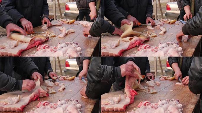屠夫正在切割，加工鲜肉。