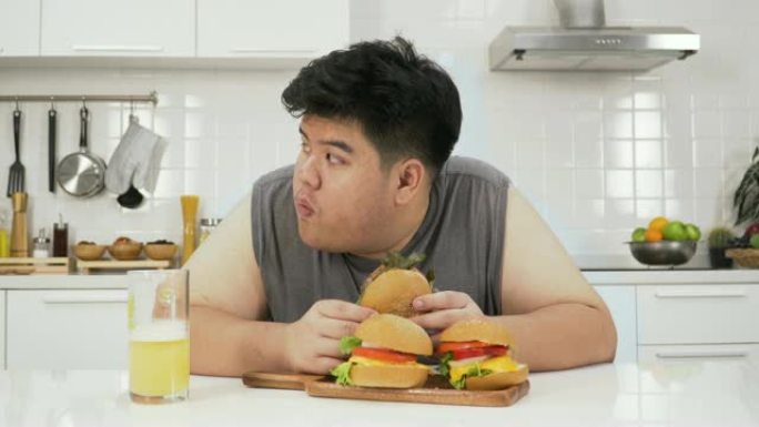 泰国超重男子是怨恨汉堡包。他只想吃他