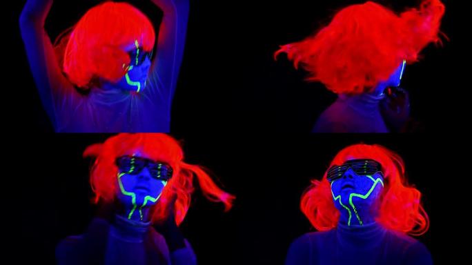 女人用紫外线半机械人的脸漆，假发，发光的服装肖像努力跳舞。亚洲女人。。