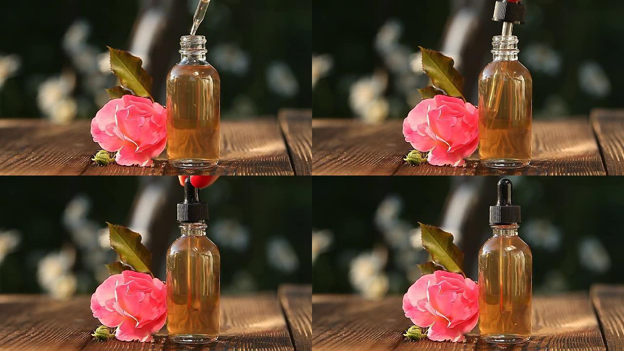 美丽玻璃瓶桌上玫瑰的精华