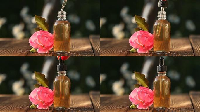 美丽玻璃瓶桌上玫瑰的精华