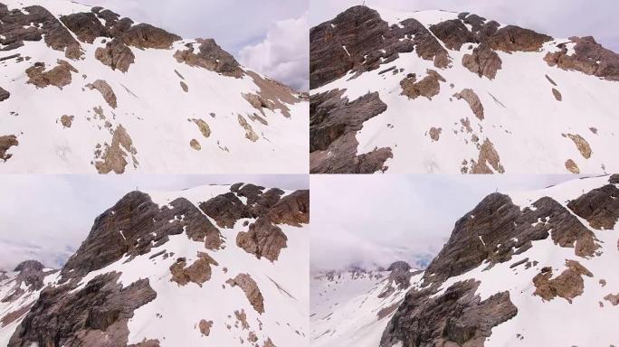 摄像机在2962米的白雪皑皑的楚格峰上空飞行。德国巴伐利亚州。