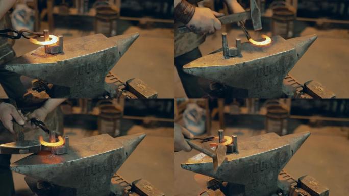 铁匠用铁锤在铁砧上工作。做马蹄铁。特写