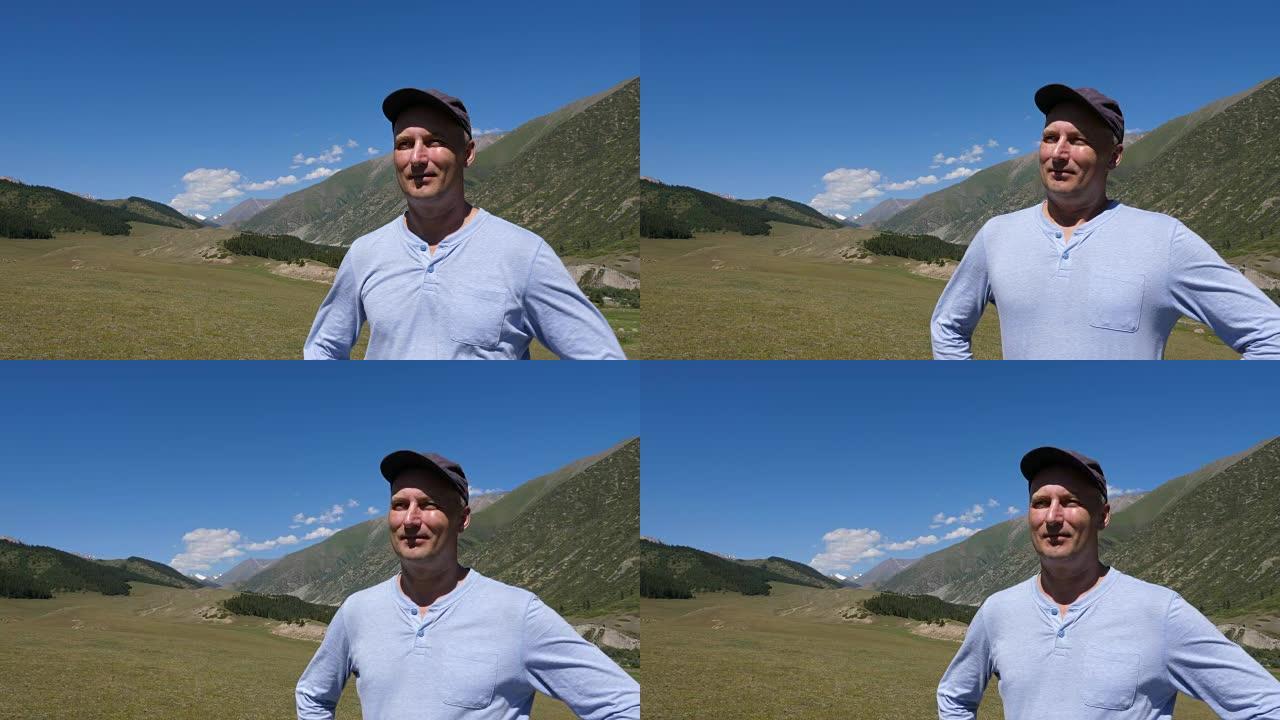 肖像成年男子站在山景上享受新鲜空气