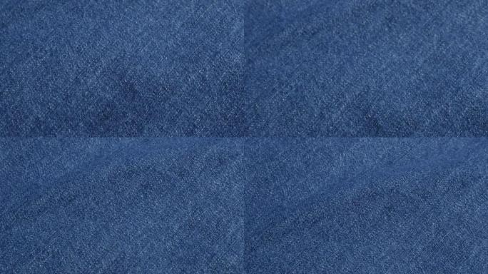 蓝色高品质牛仔布细节和纹理倾斜4K 2160p 30fps超高清视频-蓝色杜加里牛仔裤布聚集慢倾斜4
