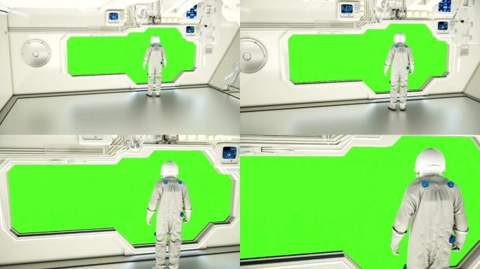 在宇宙飞船上观察宇宙的宇航员。绿屏。